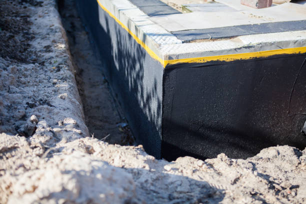 Professional Emergency Waterproofing technician working in Rockford, MI